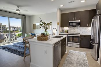 Kitchens with Crystal Diamond White quartz countertops, designer tile backsplash & ENERGY STAR stainless steel appliances